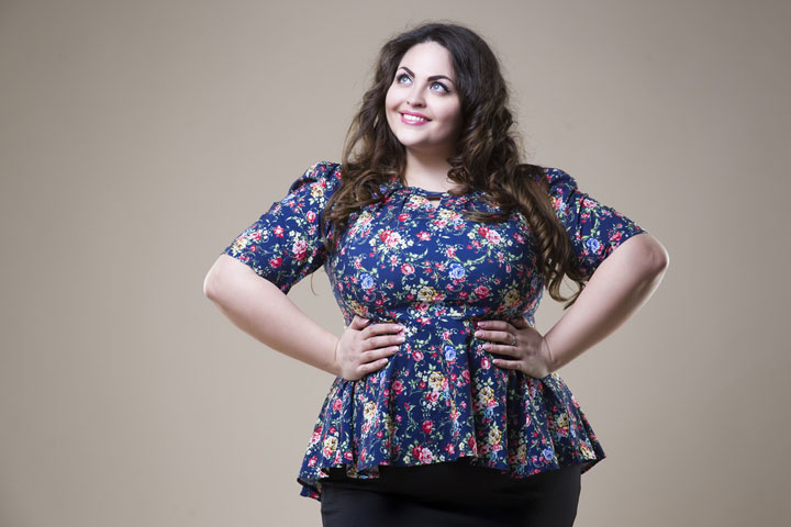 fat woman on beige studio background